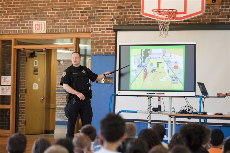 Police officer showing training slides